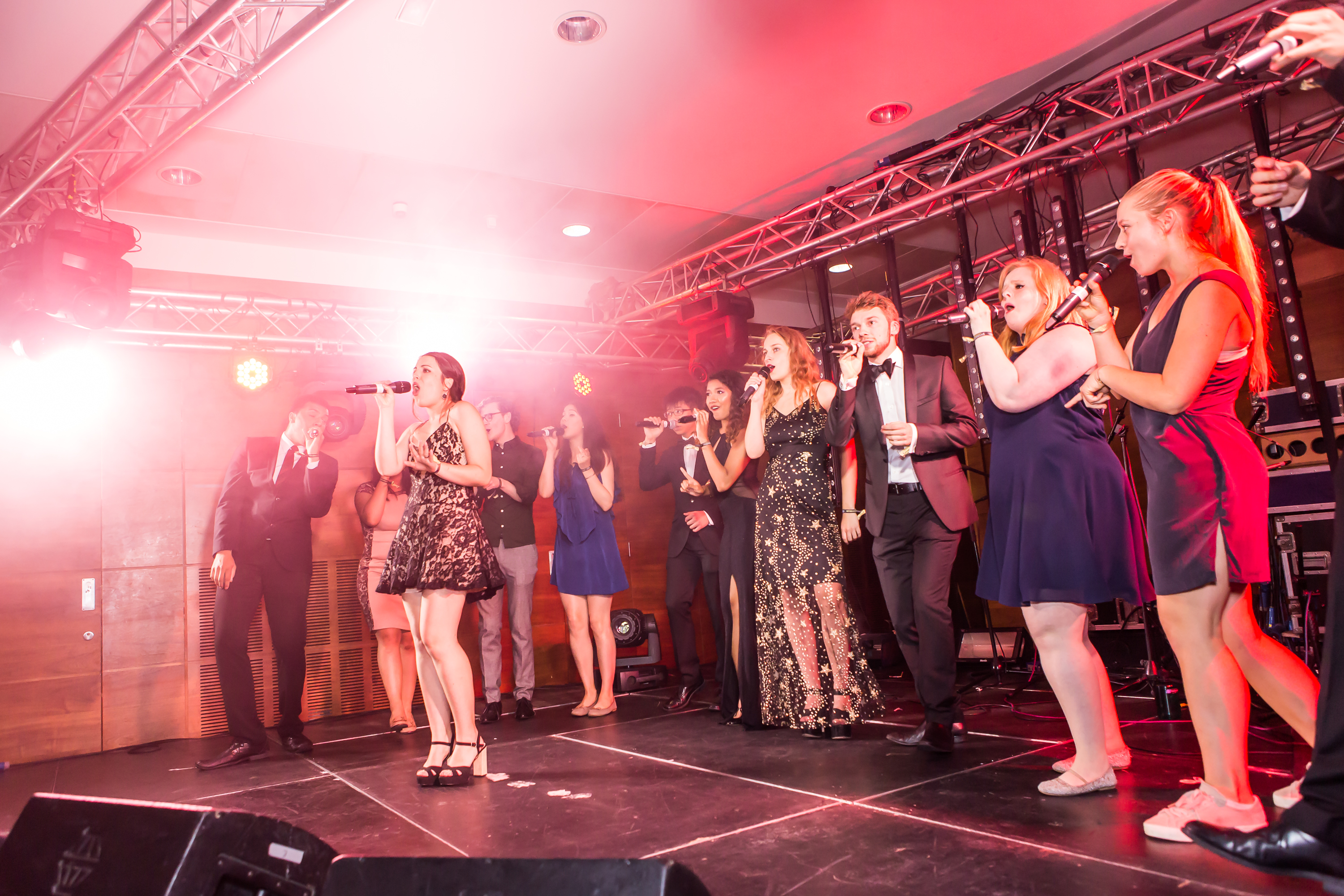 A cappella group performing on stage.